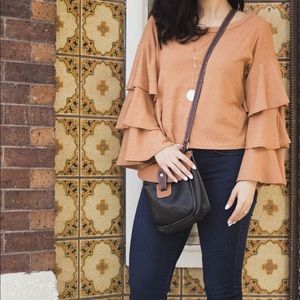 Burnt orange ruffle sleeve blouse